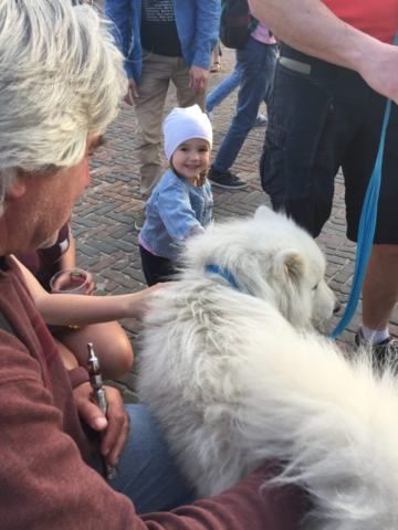 girl petting dog